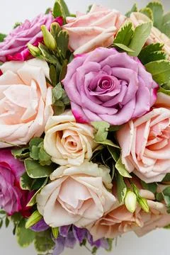 Bouquet of flowers - a composition of multi-colored roses. Stock Photos