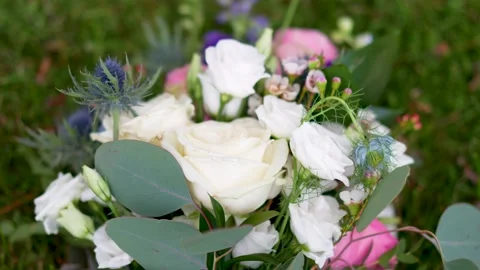 Bouquet of flowers on the grass Stock Footage 288710286
