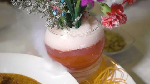 A bouquet of flowers in a vase on a table Stock Footage 155451473