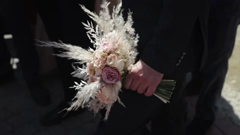 Bouquet in hands. Stock Footage 167604706
