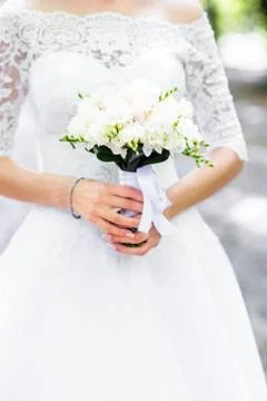 Bouquet in hands Stock Photos