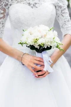 Bouquet in hands Stock Photos