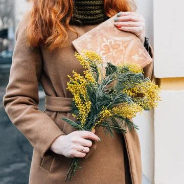 Bouquet of mimosa and a flow with a pattern Stock Photos