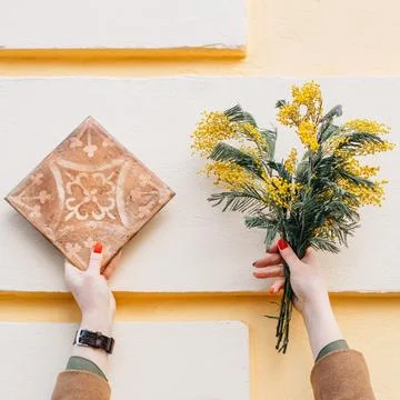 Bouquet of mimosa and a flow with a pattern Stock Photos