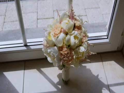 Bouquet of peonies at the window Видео 77977411