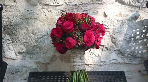 A bouquet of red flowers on the table Stock Footage 45290731