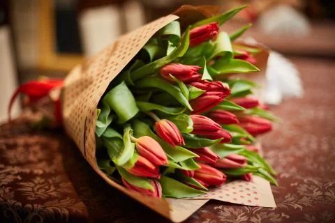 A bouquet of tulips is on the table. Stock Photos
