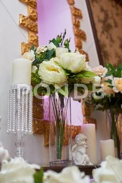 Bouquet of white peonies in vase decorated for a wedding dinner Stock Photos