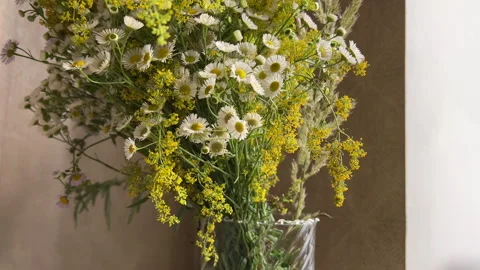 A bouquet of wild flowers on the kitchen table Stock Footage 278787487