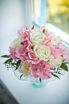 Bouquet on a window sill. Stock Photos