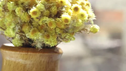 Bouquet of yellow flowers in wooden vase Video stock 172242553
