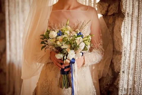 Bouquets in bride's hands Stock Photos
