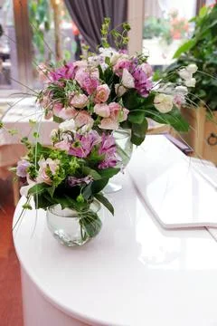 Bouquets of flowers on a white table Stock Photos