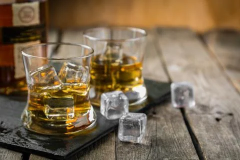 Bourbon on rustic wood background Stock Photos