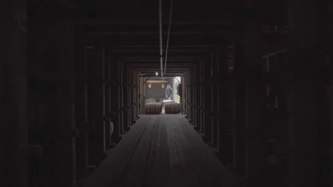 Bourbon Whiskey Barrels aging inside rick house in Kentucky Stock Footage 240028187