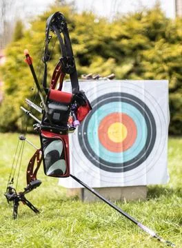 Bow and Arrows Positioned by Target in Grass Stock Photos