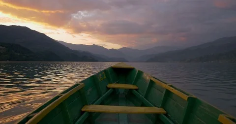 Bow of the boat floating in lake on sunset Video stock 70409106