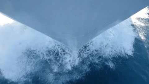Bow of a boat with wake while sailing through water Stock Footage 194948383