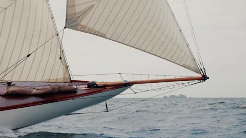 Bow of a classic old sailing ship plunges into rough seas, creating water sprays Stock Footage 344230564