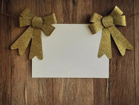 Bow Decorations with text space on white paper on a wooden background. Vintage Stock Photos