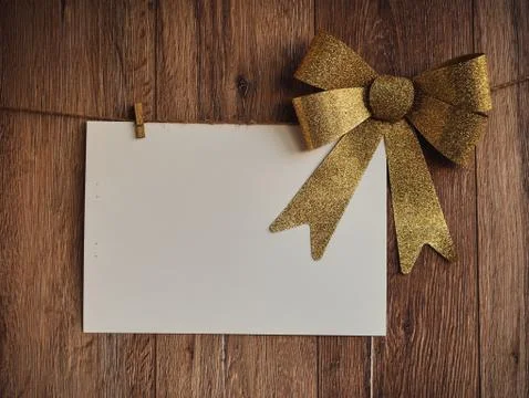 Bow Decorations with text space on white paper on a wooden background. Vintage Stock Photos