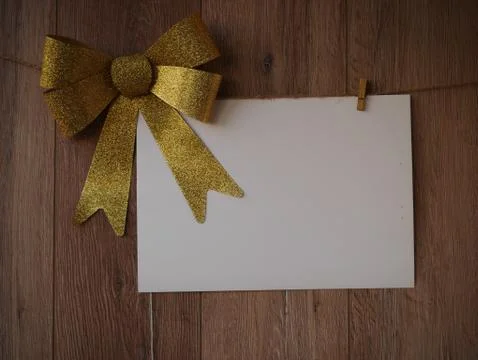 Bow Decorations with text space on white paper on a wooden background. Vintage Stock Photos