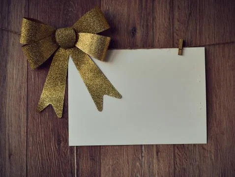 Bow Decorations with text space on white paper on a wooden background. Vintage Stock Photos
