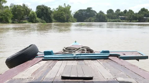 The bow, front of the vintage boat float straight ahead along river. Stock Footage 197348569