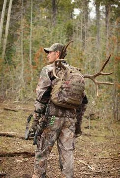 Bow hunter backpacking deer Stock Photos