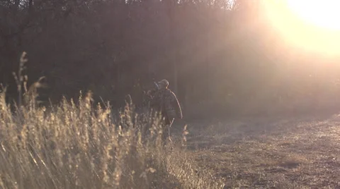 Bow hunter prepares to hunt Stock Footage 33126100