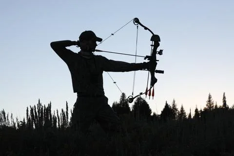 Bow hunter silhouette Stock Photos
