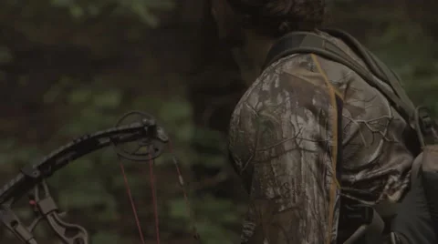 Bow hunter walking in woods Stock-Footage 53644462
