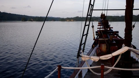 Bow of phinisi boat navigating towards tropical islands Stock Footage 112483567