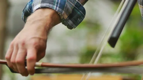 BOW PLAYS VIOLIN Stock Footage 183468385