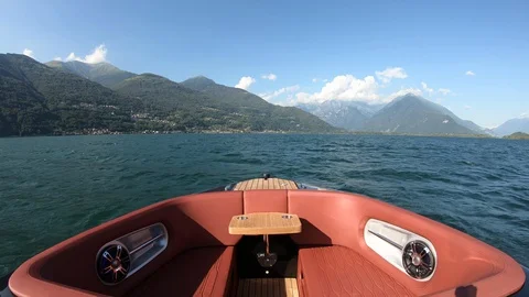 Bow rider boat navigating fast on lake of Lecco. Stock Footage 128860918