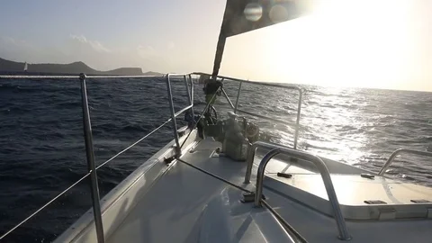 Bow of a sailboat aproaching an island Stock Footage 85458518