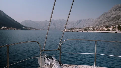 Bow of sailing boat navigating through waves in the Adriatic sea. Slow motion. Stock Footage 128481021