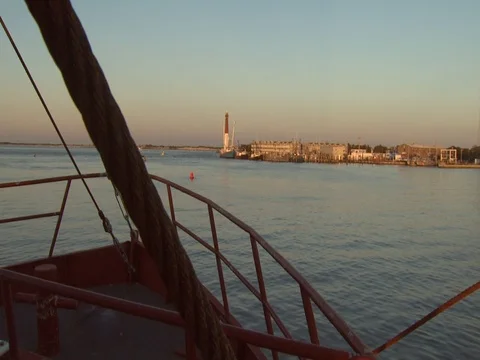 BOW OF SHIP APPROACHING LIGHTHOUSE Stock Footage 76584092