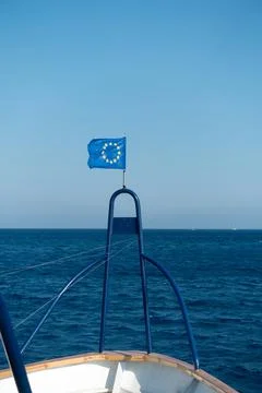 Bow of a ship with a developing EU flag Stock Photos