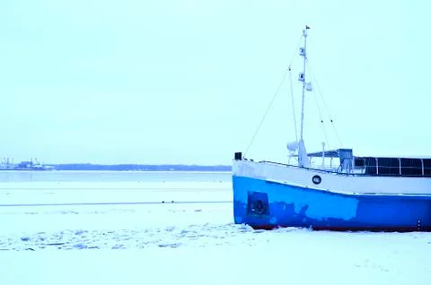 The bow of the ship in the ice on a large river in early winter Stock Photos