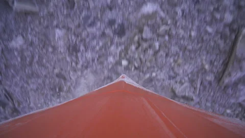 Bow of ship. Top down view. Chunks of ice and water are rushing by. Stock Footage 165952205