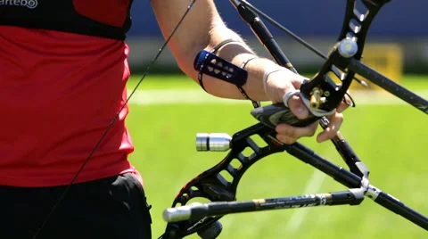 Bow shooting hands only Stock Footage 62498556