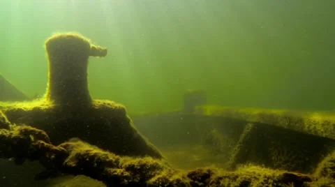 Bow side of an old underwater shipwreck deck with sun beams Video stock 55376777