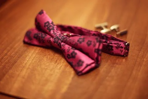 Bow tie and cufflinks on table Stock Photos