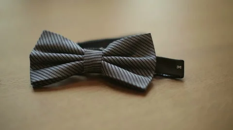 Bow tie on a wooden table Stock Footage 52532720
