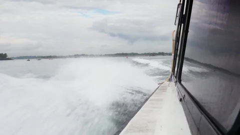Bow wave water splashing on side of speed power boat Bali July 2017 Video stock 83681310