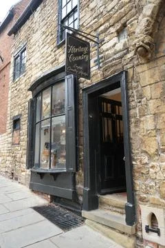 Bow window shopfront in a medieval stone building in Lincoln Stock Photos