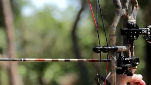 Bowhunter loading and shooting an arrow Stock Footage 171996577