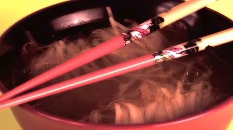 Bowl of asian noodles and a pair of chopsticks Stock Footage