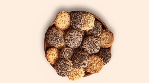A bowl of assorted cookies with some of them having chocolate chips Stock Footage 284536185